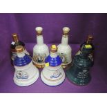 Seven ceramic bottles of Bells whisky including 20 year old Royal Reserve