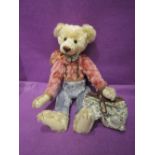 A Rosalie Frischmann Mill Creek jointed bear, Baxter Bell Hop, height 16 inches