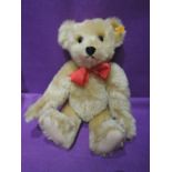 A Steiff replica 1909 jointed bear having growling mechanism, yellow tag in ear, height 17 inches