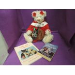 A 1990's Carol-Lynn Rossel Waugh jointed bear wearing red and white dress, height 22 inches along