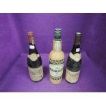 A bottle of D'Oliveirar Vinho Madeira 1957 old wine 70cl 18.5%, a bottle of Gevrey Chamberlin