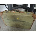 A canvas bound travel trunk or suitcase