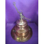 An industrial copper and brass ceiling light shade possibly nautical related with swinging