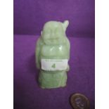 A hand carve Jade figure of a travelling Buddah