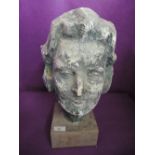 A plaster cast model replica of a female head in a 60's design