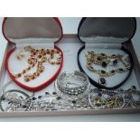 A selection of diamante costume jewellery including two cased sets, bangles etc