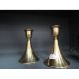 A pair of conical design antique candle sticks bearing reg no 8616 to cast base with brass body