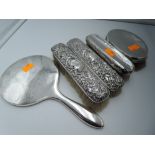 Four HM silver backed brushes and a HM silver hand mirror with no glass