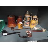 A selection of tobacco smokers pipes and selection of tankards