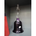 A large glass bell with purple centre