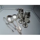 A small selection of silver plate including duck moneybox, salt and pepper, sugar nips, etc