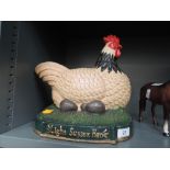 A heavy cast door stop or similar Light Sussex Hen figure