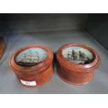 Two wooden storage containers with galleon imagery