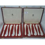 Two sets of six mother of pearl caviar/butter knives in fitted cases by Asprey & Co Ltd