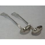 A pair of Georgian Scottish silver sauce ladles in the Kings pattern monogrammed P to terminals,