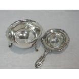 An Edwardian silver tea strainer having moulded decoration to rim, Birmingham 1909, E F Braham Ltd