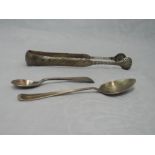 A pair of Georgian Scottish silver sugar nips having engraved floral decoration and scalloped bowls,