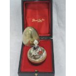 A cased Stuart Devlin silver gilt surprise egg for year 1975, Limited edition no 170, containing a