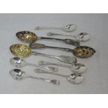 Three Victorian silver berry spoons having shaped bowls and engraved terminals, London 1850/76,