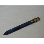 A blue agate letter opener by Kutchinsky having a stylised 18ct gold mount/handle bearing Kutchinsky