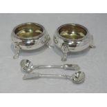 A pair of Victorian silver salts of traditional plain circular form having gadrooned rims and