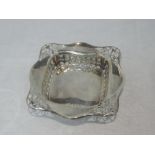A silver trinket tray of square form having pierced decoration, Birmingham 1919, Lawson, Son & Ward