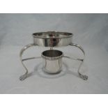 A Georgian silver circular spirit burner stand having reeded trefoil legs on animalistic feet,