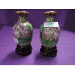 A pair of cloisonné style vases