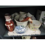 A selection of ceramics including a monk decantor