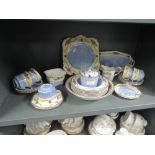 A selection of Chelsea hand painted wares including tea cups and saucers