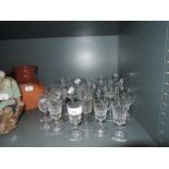 A selection of clear cut and crystal spirit and wine glasses including named brands