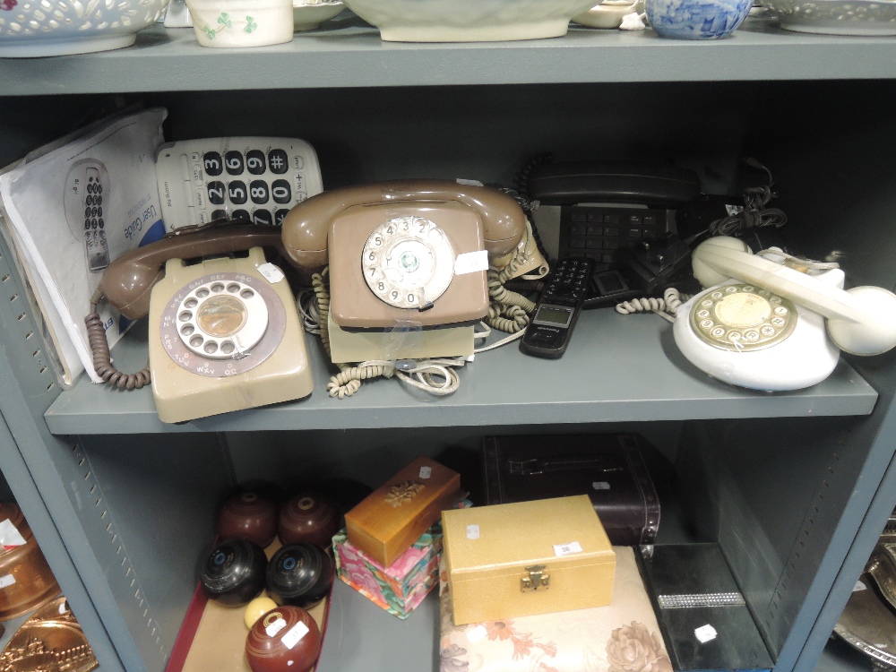 A selection of vintage telephones in various designs and styles