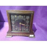A bracket clock or similar with chime and Art Deco design face plate