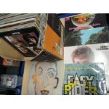 A large box of albums , including Beatles , Animals and Iron Butterfly plus many more