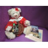 A 1990's Carol-Lynn Rossel Waugh jointed bear wearing red and white dress, height 22 inches along