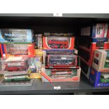 A shelf of modern Corgi and EFE diecast Buses and Trams, all boxed