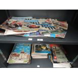 Two shelves of 1960's and later Diecast catalogues, magazines and similar ephemera including