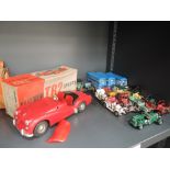 A Victory Industries 1:18 scale battery operated plastic model, Triumph TR2 Sports Car in red with