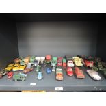 A shelf of playworn diecasts including Dinky, Corgi, Lesney etc including Dinky Renault Dauphine