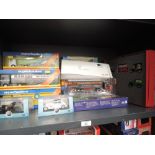 A shelf of modern diecast articulated wagons and cars including Corgi, Oxford, Lledo etc including