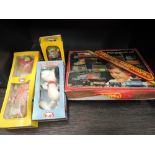 Three Pelham Puppets, Snoopy, Cat and Mitzi, all boxed along with a Hornby 00 gauge Pick-Up Goods