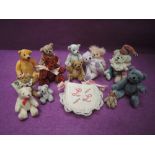 Eight miniature Catherine White jointed bears, heights 1- 3 inches and four similar miniature bears,