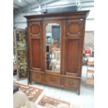 An early 20th Century oak wardrobe