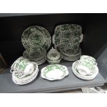 A part tea service by Coalport with green glaze Chinese dragon design