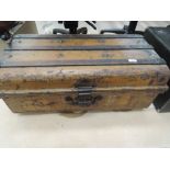 A vintage tin travel trunk