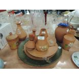 A selection of hand decorated terracotta Torquay wares