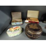 An enamalled trinket box and contents including a mother of pearl handled pen knife, and vintage tin