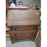 An early to mid 20th Century oak bureau