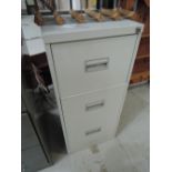 A modern three drawer metal filing cabinet