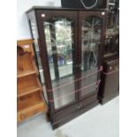 A modern mahogany effect display cabinet